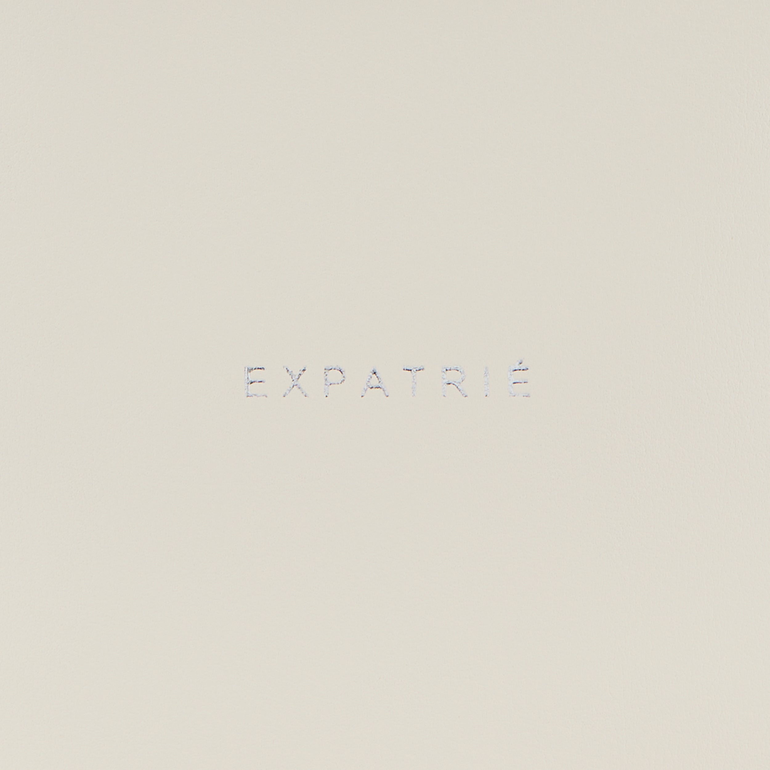 Logo der Marke Expatrié in minimalistischer Gestaltung