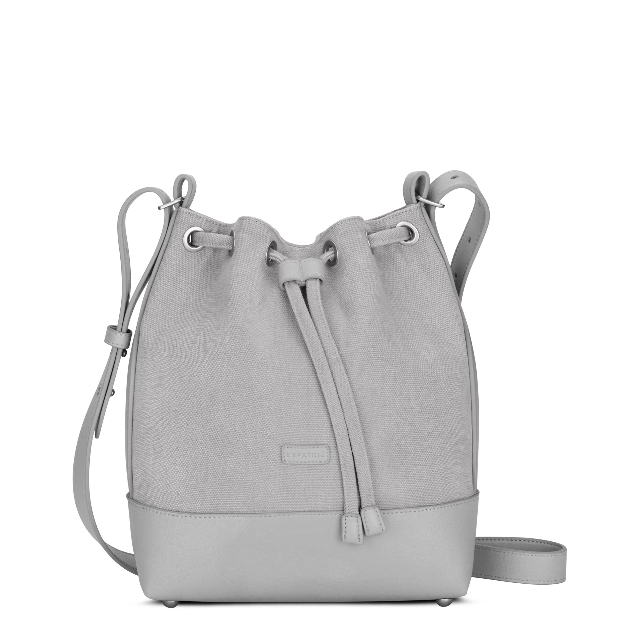 Graue Beuteltasche Lily aus Stoff und Leder mit Kordelzugverschluss und verstellbarem Schulterriemen