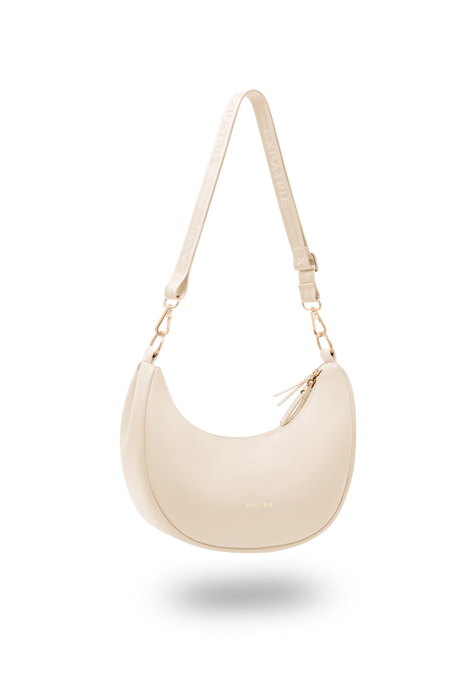 Beige LEA MEDIUM Halbmond-Tasche mit verstellbarem Schulterriemen und goldfarbener Reißverschlusslasche